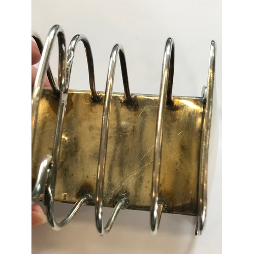 31 - An Art Nouveau silver toast rack, Keswick School of Industrial Art, Chester 1906, the six slice rack... 