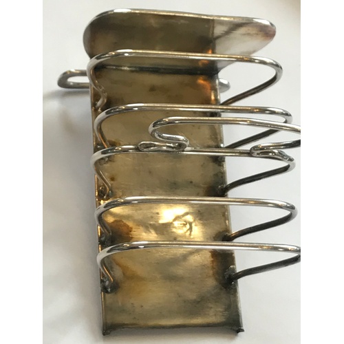 31 - An Art Nouveau silver toast rack, Keswick School of Industrial Art, Chester 1906, the six slice rack... 