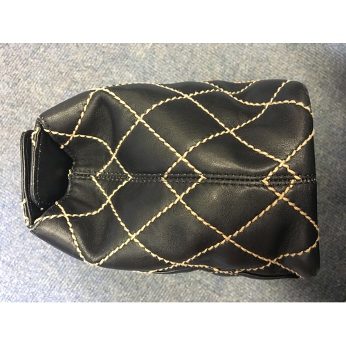A Chanel Wild Stitch top clasp handbag, circa 2000 - 2002, the black  calfskin leather bag with class