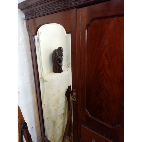 909 - A 1920's Chinese Chippendale revival mahogany compactum wardrobe, with a dentil cornice above a blin... 