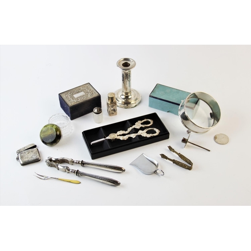 134 - A collection of silver to include; an Edwardian silver candlestick, Birmingham 1907, with tied bow g... 