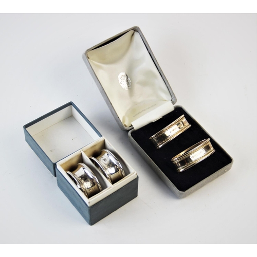 136 - A pair of silver napkin rings Rolason Brothers Birmingham 1925, each with engraved foliate decoratio... 