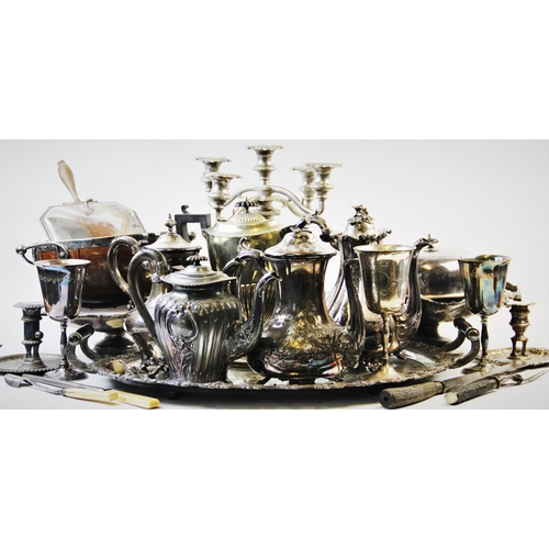 142 - A large collection of silver plated wares, to include, a white metal mounted fruit bowl, with cerami... 