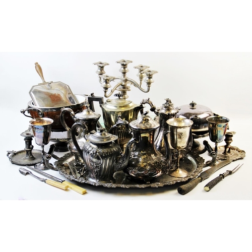 142 - A large collection of silver plated wares, to include, a white metal mounted fruit bowl, with cerami... 