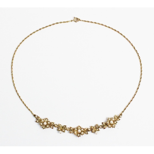 178 - A Victorian style 9ct gold and split seed pearl set necklace, designed as three floral clusters, joi... 