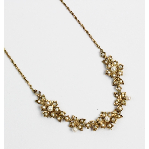 178 - A Victorian style 9ct gold and split seed pearl set necklace, designed as three floral clusters, joi... 