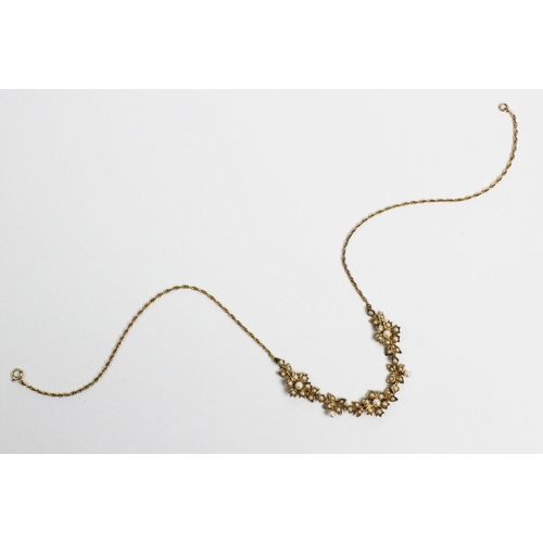 178 - A Victorian style 9ct gold and split seed pearl set necklace, designed as three floral clusters, joi... 