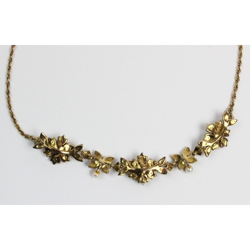 178 - A Victorian style 9ct gold and split seed pearl set necklace, designed as three floral clusters, joi... 