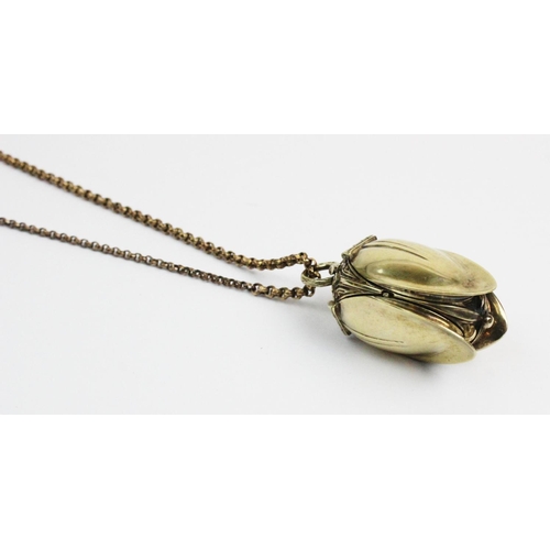 180 - A silver gilt watch pendant on chain, designed as a hanging fruit with three hinged locket 'leaf' si... 