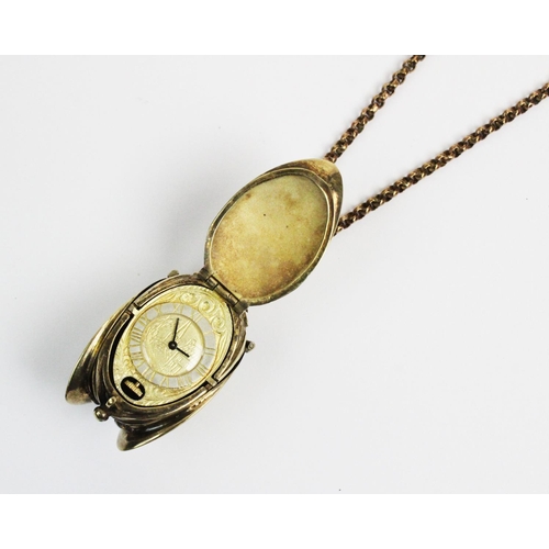 180 - A silver gilt watch pendant on chain, designed as a hanging fruit with three hinged locket 'leaf' si... 