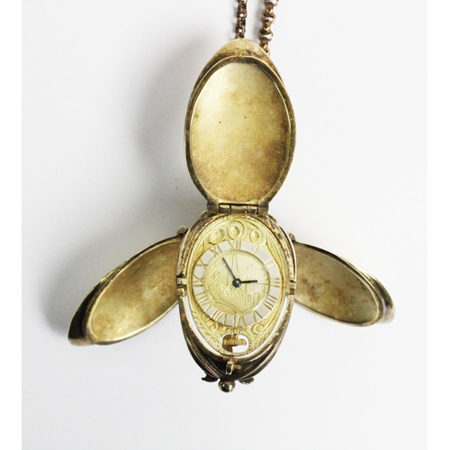 180 - A silver gilt watch pendant on chain, designed as a hanging fruit with three hinged locket 'leaf' si... 