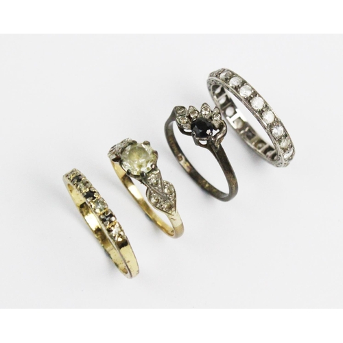 183 - A group of four rings, to include; a paste set solitaire stamped '9ct', weight 2.5gms, a full hoop e... 