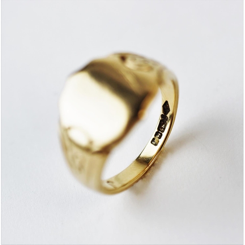 190 - A 9ct yellow gold signet ring, the shield shape ring with decorative shoulders, weight 9.3gms.