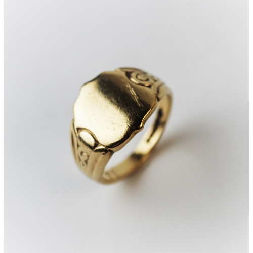 190 - A 9ct yellow gold signet ring, the shield shape ring with decorative shoulders, weight 9.3gms.