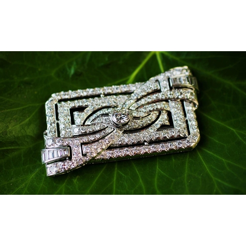 198 - A diamond set Art Deco brooch, the rectangular brooch with central stylised bow 'twist', set through... 