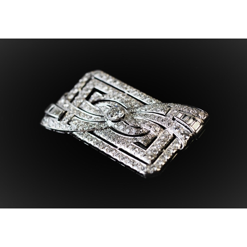 198 - A diamond set Art Deco brooch, the rectangular brooch with central stylised bow 'twist', set through... 