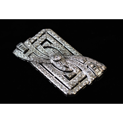 198 - A diamond set Art Deco brooch, the rectangular brooch with central stylised bow 'twist', set through... 