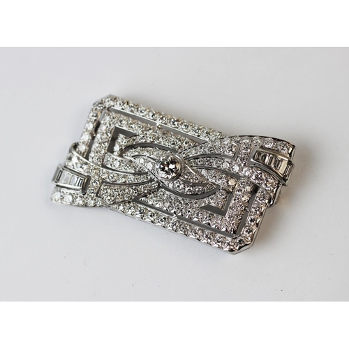 198 - A diamond set Art Deco brooch, the rectangular brooch with central stylised bow 'twist', set through... 