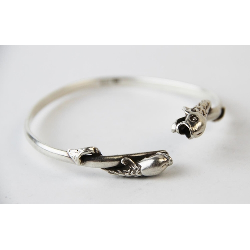 199 - A Salen Silver bangle, Edinburgh (Isle of Mull) 1990, the torque style bangle with dolphin terminals... 