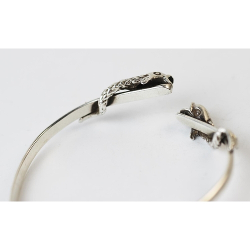 199 - A Salen Silver bangle, Edinburgh (Isle of Mull) 1990, the torque style bangle with dolphin terminals... 