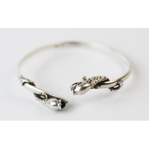 199 - A Salen Silver bangle, Edinburgh (Isle of Mull) 1990, the torque style bangle with dolphin terminals... 