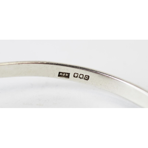 199 - A Salen Silver bangle, Edinburgh (Isle of Mull) 1990, the torque style bangle with dolphin terminals... 