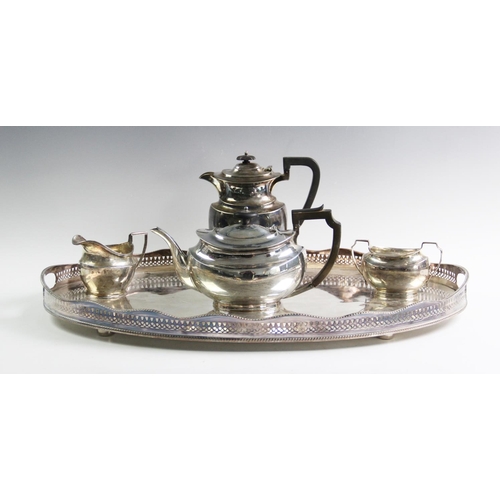 23 - A matched silver tea service, comprising; a silver teapot Atkin Brothers Sheffield 1921, with compos... 