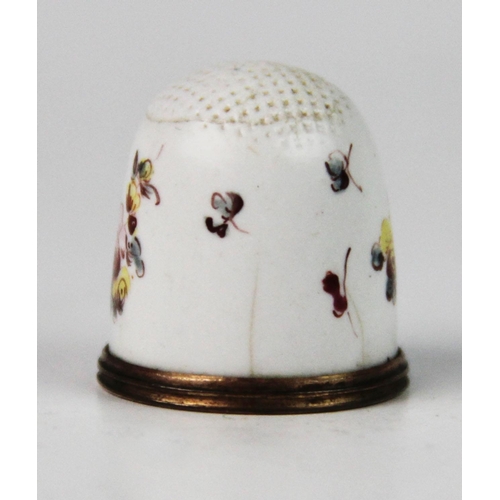 254 - A late 18th century Bilston enamel thimble, of typical form, the white ground decorated with polychr... 