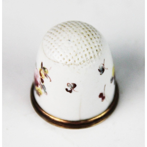 254 - A late 18th century Bilston enamel thimble, of typical form, the white ground decorated with polychr... 