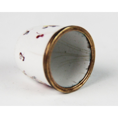 254 - A late 18th century Bilston enamel thimble, of typical form, the white ground decorated with polychr... 