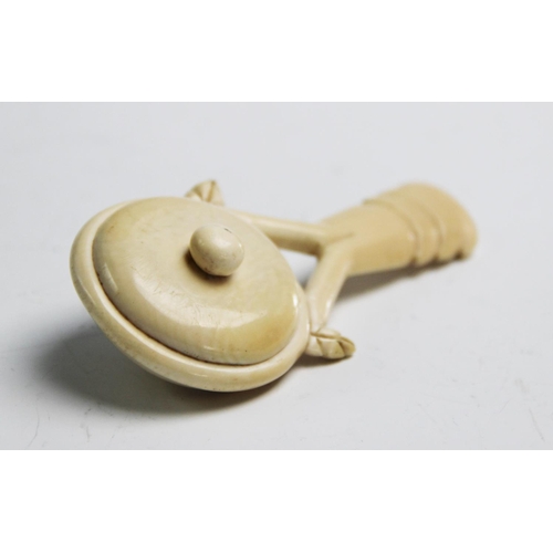 267 - A 19th century Indian ivory baby's rattle, carved handle, 11cm long