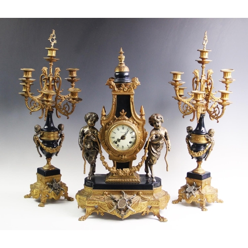 367 - An Italian Brevettato Imperial gilt metal clock garniture, 20th century, the clock adorned with cast... 