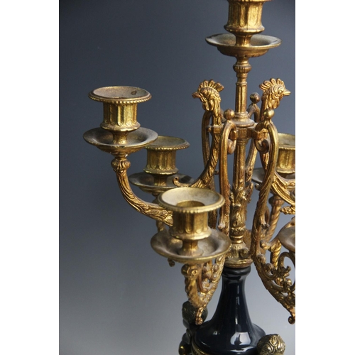 367 - An Italian Brevettato Imperial gilt metal clock garniture, 20th century, the clock adorned with cast... 