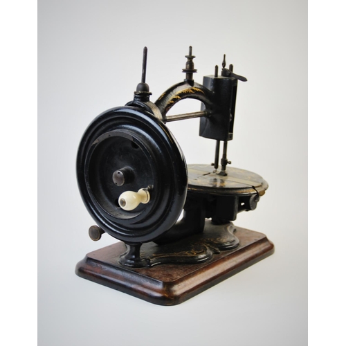 392 - A late 19th century Prima Donna Lockstitch sewing machine, circa 1870, by Wright and Mann, the C fra... 