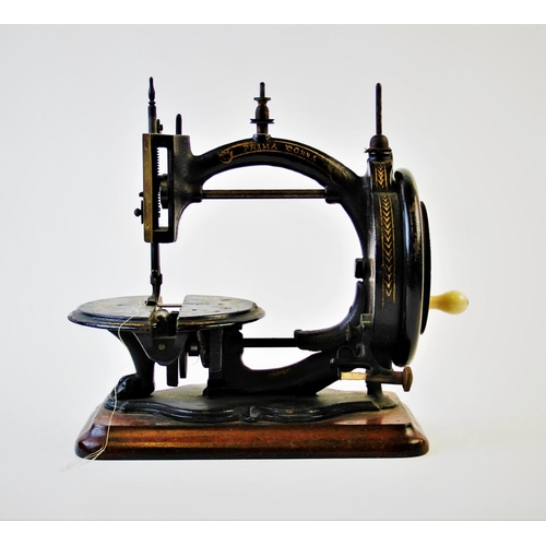 392 - A late 19th century Prima Donna Lockstitch sewing machine, circa 1870, by Wright and Mann, the C fra... 