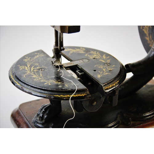 392 - A late 19th century Prima Donna Lockstitch sewing machine, circa 1870, by Wright and Mann, the C fra... 