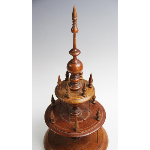 399 - A Victorian treen cotton reel holder, with two graduated tiers, each with six wire holders applied w... 