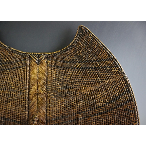 409 - A Mambila 'Kor' Shield, Cameroon, with wood and braided palm fibre body, decorated with geometric pa... 