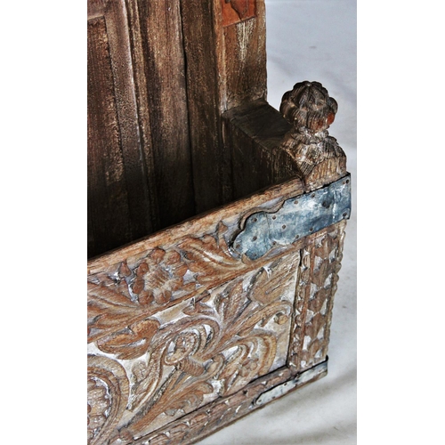 423 - A Rajasthani rustic hardwood balcony door, with an iron bar grille above a pair of panelled doors, w... 