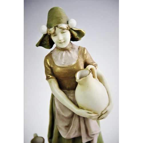 512 - An Ernst Wahliss porcelain figurine, late 19th/early 20th century, modelled as a flower boy holding ... 