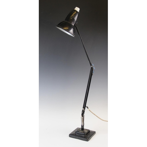 527 - A mid 20th century black angle poise lamp, by Herbert Terry, the bell shaped metal shade with a roll... 