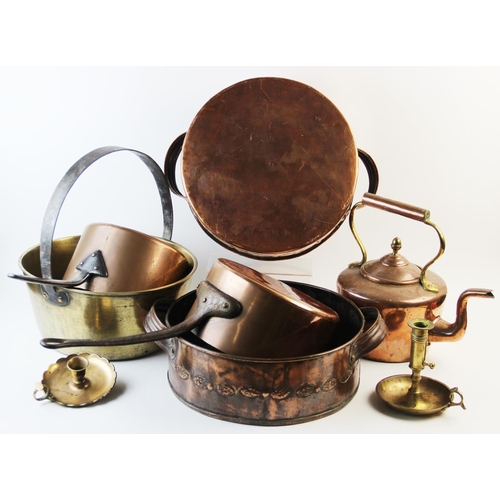 540 - A pair of twin handled copper pans, 19th century, each pan with riveted ribbed loop handles and scro... 