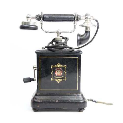 566 - A vintage Danish Jydsk Telefon Aktieselskab hand cranked pillar telephone, early 20th century, the p... 