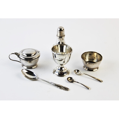 64 - A cased silver condiment set, E J Houlston Birmingham 1922, each of cylindrical form, comprising sal... 