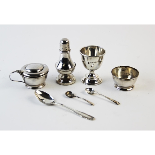 64 - A cased silver condiment set, E J Houlston Birmingham 1922, each of cylindrical form, comprising sal... 