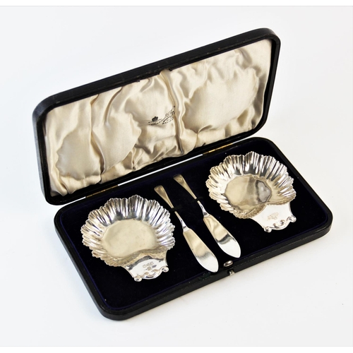 66 - A cased pair of Victorian silver butter dishes, James Deakin and Sons Chester 1894, each of scallope... 