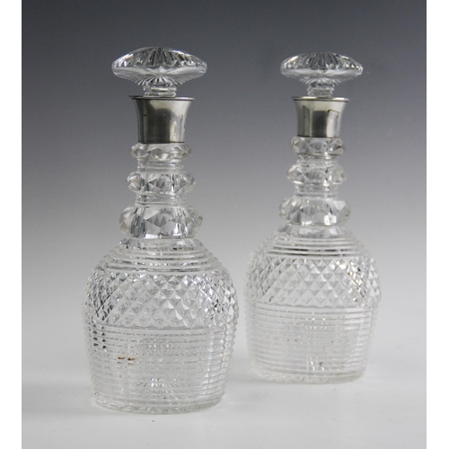 68 - A pair of silver mounted hob nail cut glass decanters and stoppers, John Grinsell and Sons, Birmingh... 