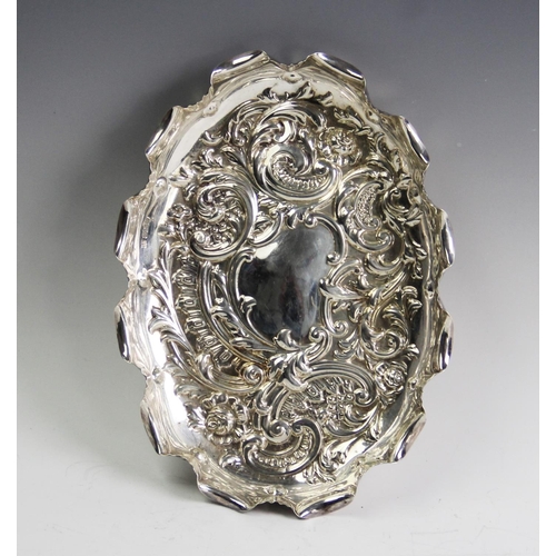 71 - An Edwardian silver tray, Fenton Brothers Ltd, Sheffield 1907, of oval form and embossed with scroll... 