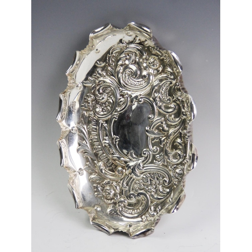 71 - An Edwardian silver tray, Fenton Brothers Ltd, Sheffield 1907, of oval form and embossed with scroll... 