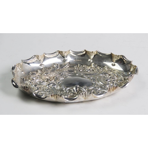 71 - An Edwardian silver tray, Fenton Brothers Ltd, Sheffield 1907, of oval form and embossed with scroll... 